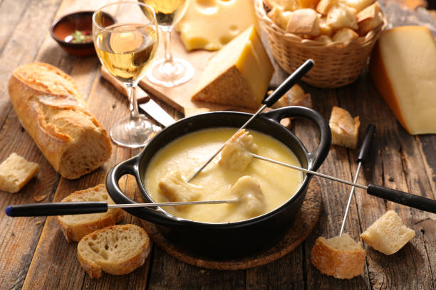cheese fondue and bread cheese fondue and bread baguette photos stock pictures, royalty-free photos & images