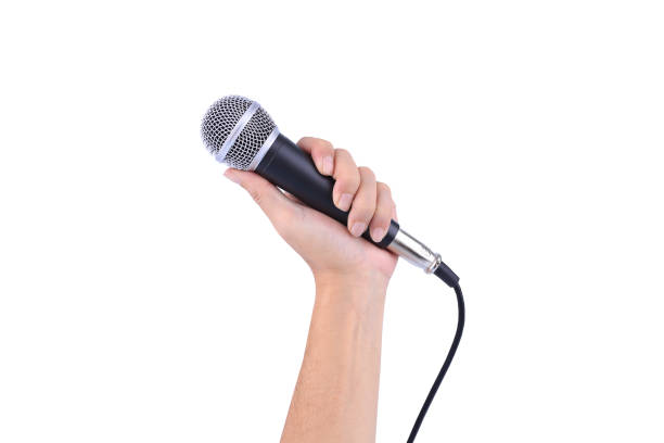 hand with a microphone isolated on white background stock photo