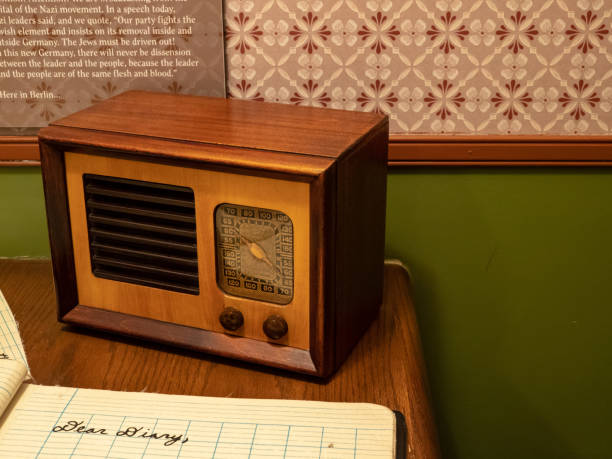 istock Antique transistor radio sitting in a child's room with a diary 1028631486