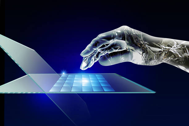 istock A metallic hand of an artificial intelligence robot that hits a keyboard of a laptop computer. 1028640824