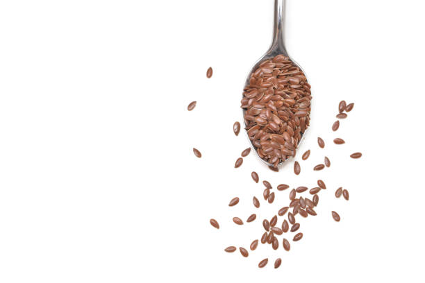 Brown flaxseeds  on white background - isolated
