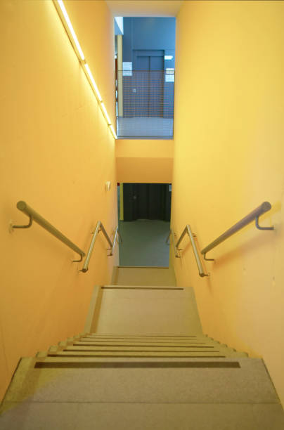 istock Yellow walls building interior with stairs and handrails. Nobody 1028643270