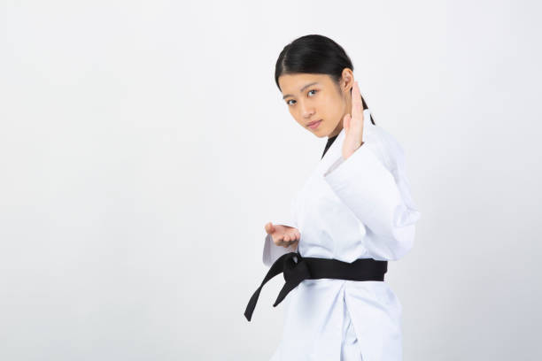 istock Woman wearing Karate uniform performing Karate Kata 1028647126