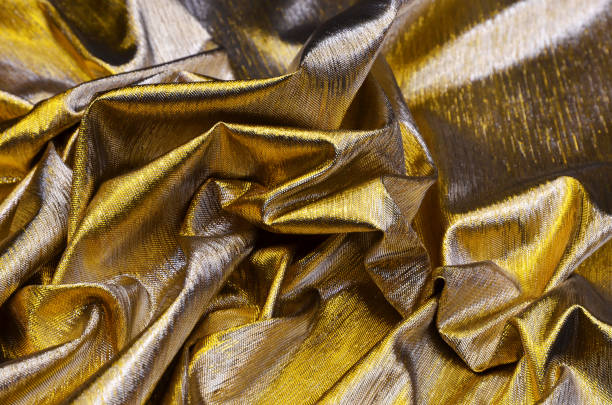istock Fabric of golden color 1028647618