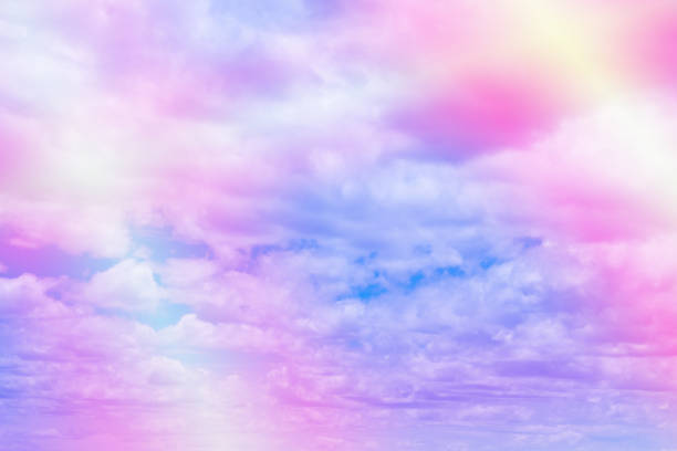 istock Sweet pastel colored cloud and sky with sun light, soft cloudy with gradient pastel color background. 1028650984