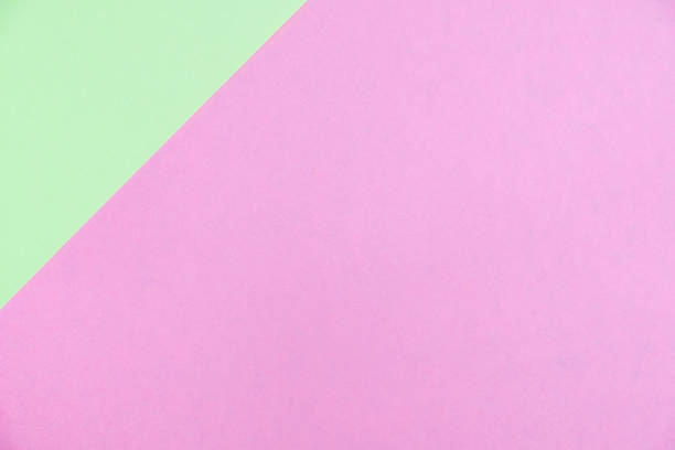 istock Pastel colored paper flat lay top view, background texture, green and pink 1028651212