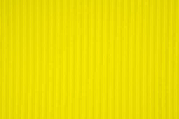 istock Yellow corrugated paper texture, use for background. vivid colour with empty space for add text or object. 1028652304