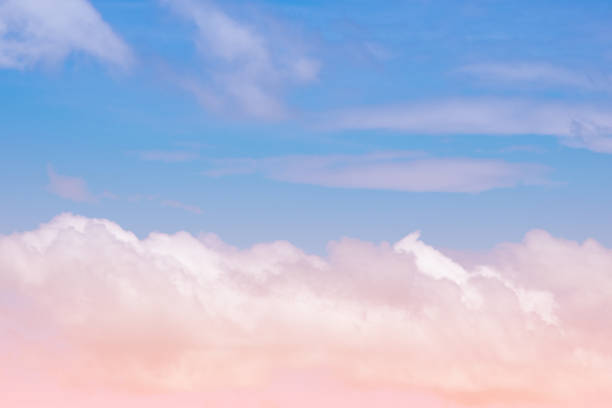 istock Sweet pastel colored cloud and sky with sun light, soft cloudy with gradient pastel color background. 1028652664