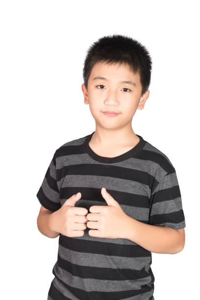 istock Asian boy kid making, showing thumbs up with a Smiling, isolated on white. 1028652778