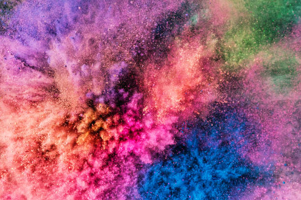 istock Colorful holi powder blowing up. 1028657908