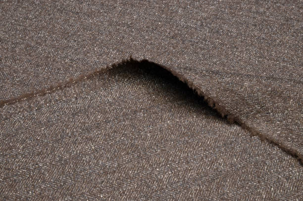istock Suit fabric, tweed is brownish-gray of wool. 1028661586