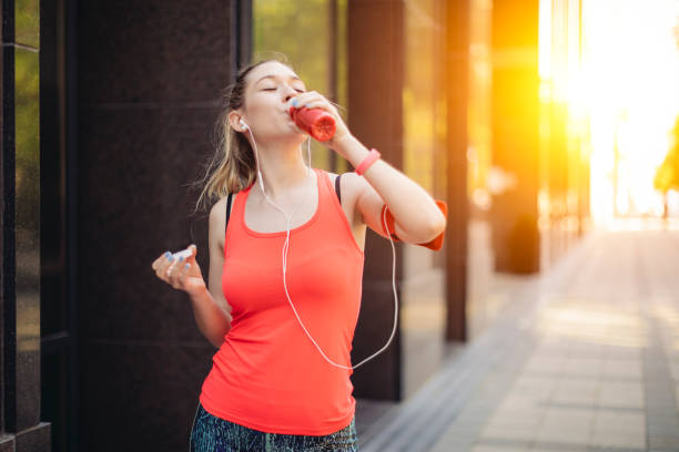 istock Young woman is drinking before exercising 1028661652