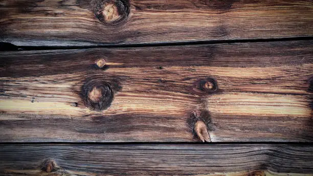 Photo of Wooden texture background with different colours of wood