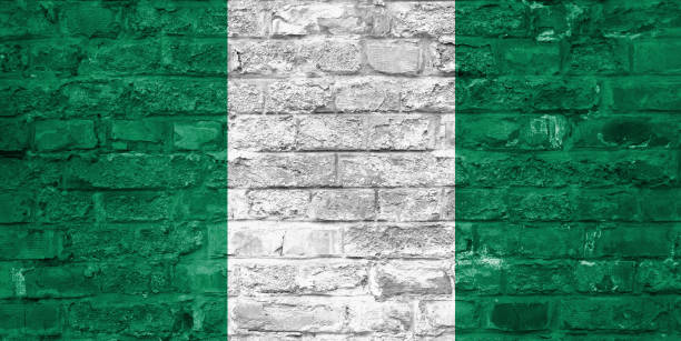 istock Flag of Nigeria over an old brick wall background, surface 1028676982