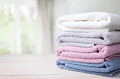 Towels stack on table empty space background.