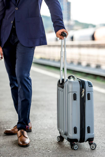 istock Businessman holding a suitcase 1028686550