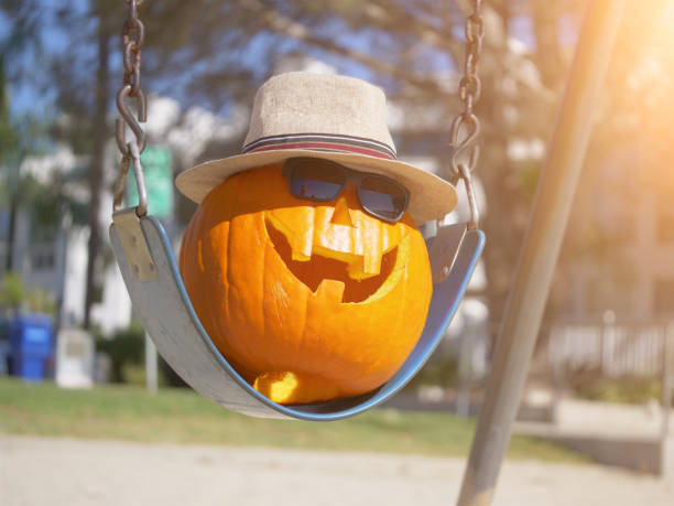 istock Happy Halloween pumpkin on the swing 1028686970