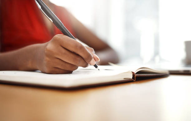 istock Writing down her agenda for the day 1028690932