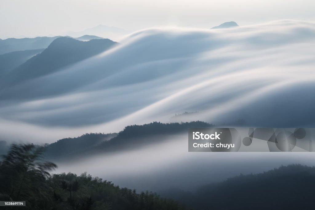 flowing clouds closeup on mountains flowing clouds closeup on mountains, spectacular clouds from waterfalls,long time exposure Mountain Stock Photo