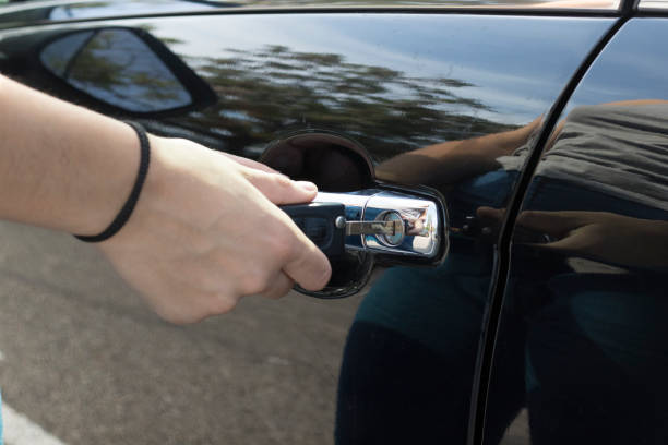 istock Inserting car key in the car 1028691170