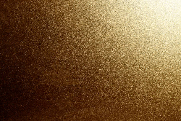 istock Ground glass texture in orange color with light in corner. 1028691282
