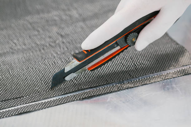 istock Cutting Raw Carbon fiber composite material 1028694562