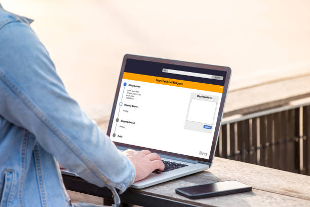istock Online Shopping concept on screen. A man is working using laptop doing online shopping with application at outdoor 1028695852