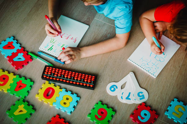 istock little girls learning numbers, arithmetic, abacus calculation 1028699354