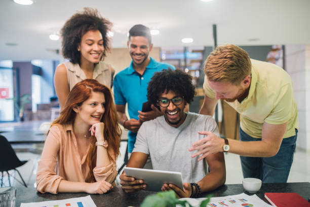 istock A group of enthusiastic young people talking in a an office 1028699870