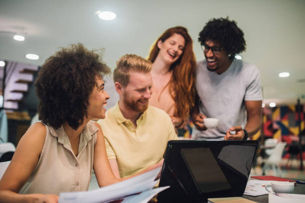 istock Young business people discussing a presentation 1028706366