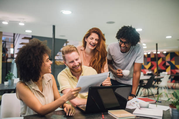 istock Happy young business people looking at a document 1028706414