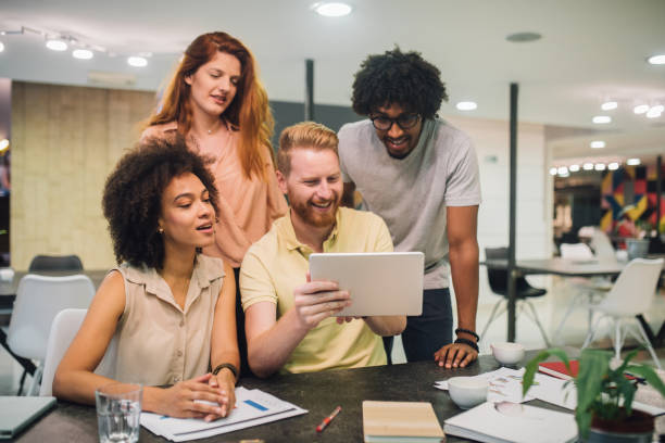 istock Pretty young people are discussing business in an office 1028706638