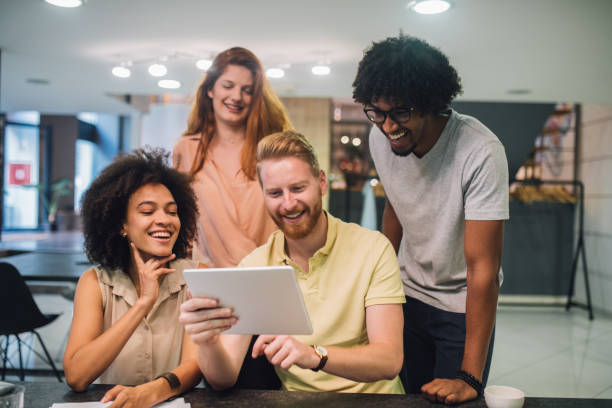 istock Enthusiastic young people in a business office 1028706722