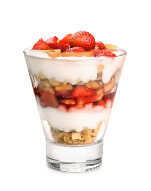 Glass of fruit and yogurt parfait isolated on white