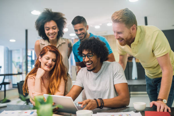 istock Happy young people doing business in an office 1028706814