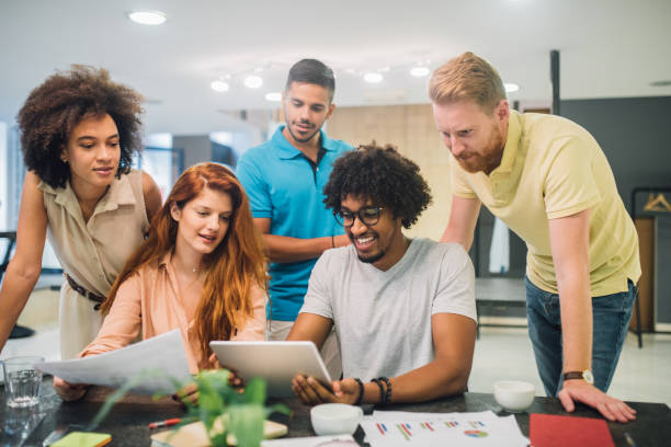 istock Enthusiastic young people doing business in an office 1028706914