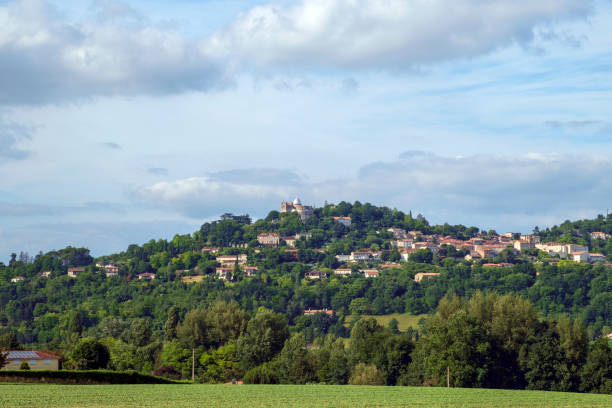 istock Early summer view across fields to hilltop Penne d'Agenais. 1028707334