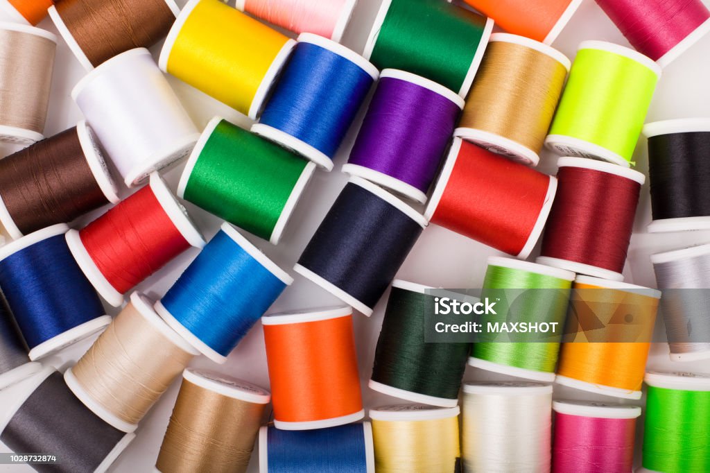 Set of colorful thread spools. Colorful background with sewing thread. Abstract Stock Photo