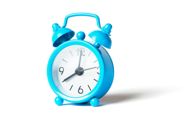 istock Blue alarm clock isolated on white background 1028733356
