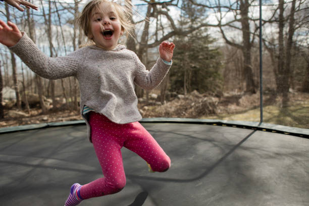 istock Little girl jumping on a trampoline 1028739704