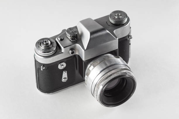 istock Retro vintage film camera on white background 1028739914