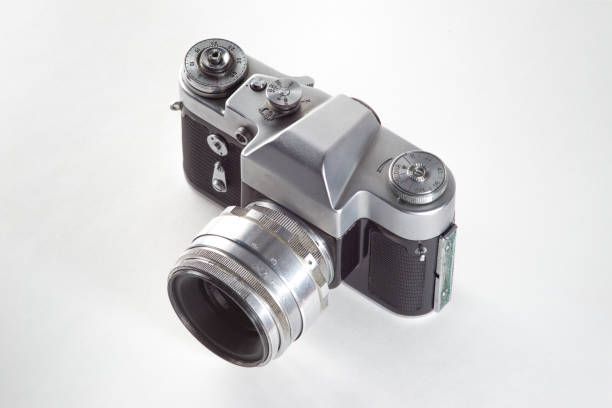 istock Retro vintage film camera on white background 1028739974
