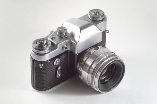 istock Retro vintage film camera on white background 1028740004