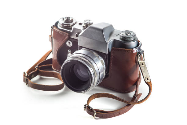 istock Retro film camera and belt bag (leather case) on white background 1028740180