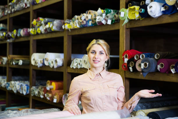 istock Salesgirl working in fabric store 1028741356