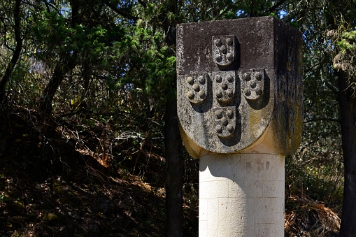 Columna de piedra Vila Verde de Ficalho - marcador de la frontera - con el escudo Portugués, Serpa, Alentejo, Portugal photo