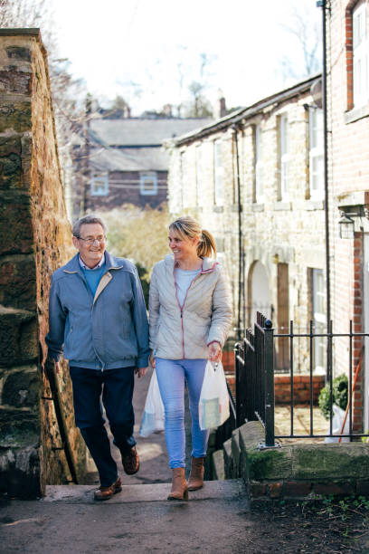 istock Walking Home from the Shops with his Carer 1028757878