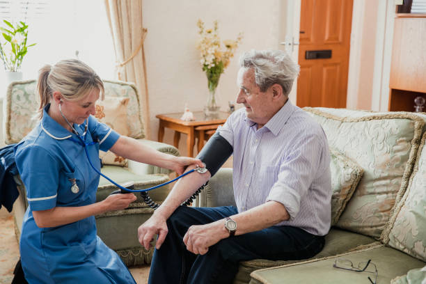istock Nurse Checking her Patient's Blood Pressure 1028758066