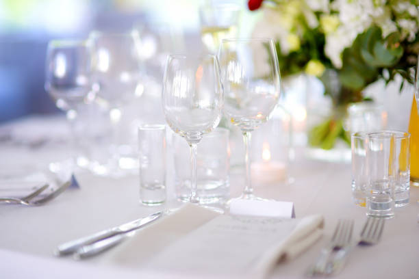 istock Beautiful table setting with crockery and flowers for a party, wedding reception or other festive event 1028761240