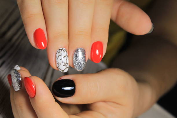 istock Stylish manicure nails color black and silver 1028766714
